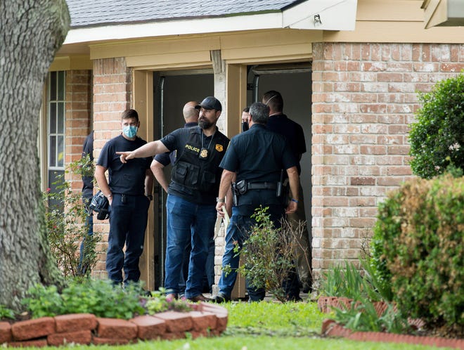 Police officers are investigating the site of a people smuggling site that found more than 90 undocumented immigrants in a house on the 12200 block of Chessington Drive in Houston on Friday, April 30, 2021.  A Houston Police officer said the case is being processed by federal authorities.