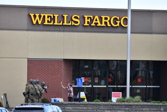 The first female hostage comes from the Wells Fargo bank building where she was held for hours, St. Cloud police said.