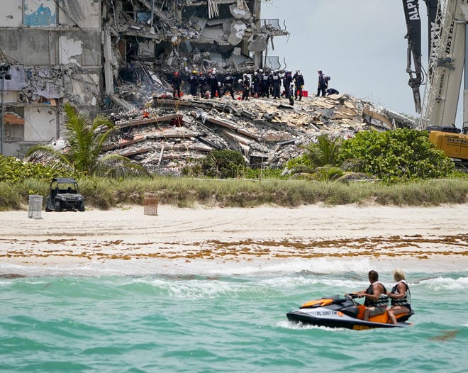 Search and Rescue crews continue to search for signs of life in the partially collapsed Champlain Towers South condo in Surfside, Florida Saturday June 26, 2021.