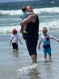 Freedy and three of his five children spend time on the beach during a trip to San Diego, California.