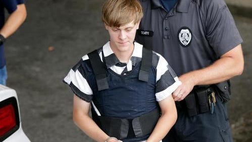 Dylann Storm Roof is escorted from the Cleveland County Courthouse in Shelby, NC on June 18, 2015.  Roof is a suspect in the shooting of several people at the historic Emanuel African Methodist Episcopal Church in Charleston.