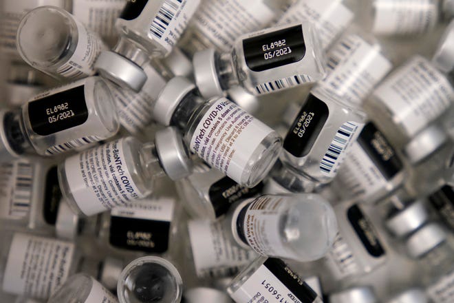 Empty vials of Pfizer-BioNTech COVID-19 vaccine are seen at a vaccination center at the University of Nevada, Las Vegas on January 22nd.