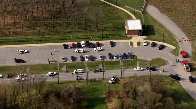 In this photo by WJLA, police react to the scene of a shooting in Frederick, Md., On Tuesday, April 6, 2021.